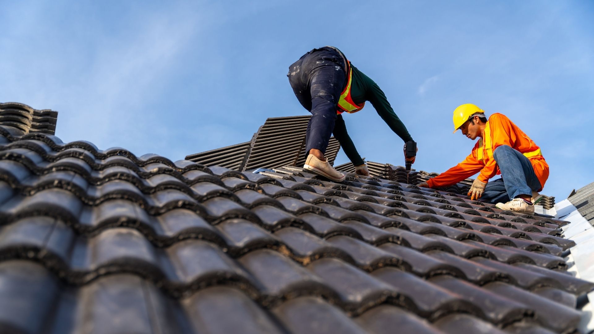 professionals installing new roof
