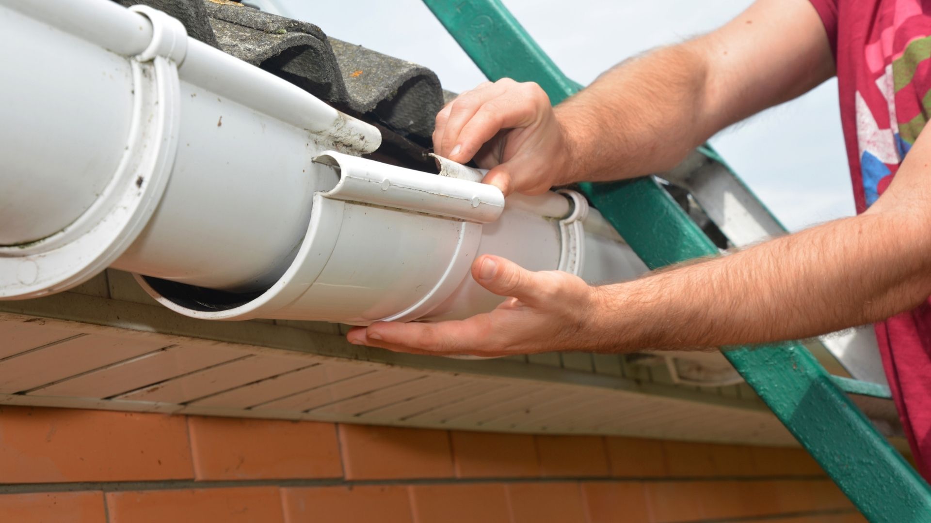 professional installing new gutter