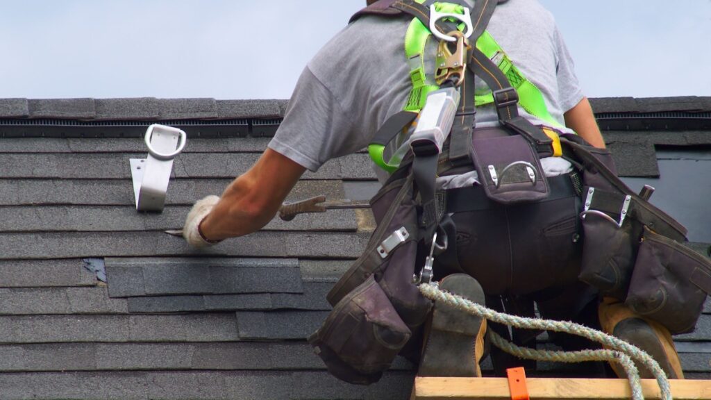 professional working on roof